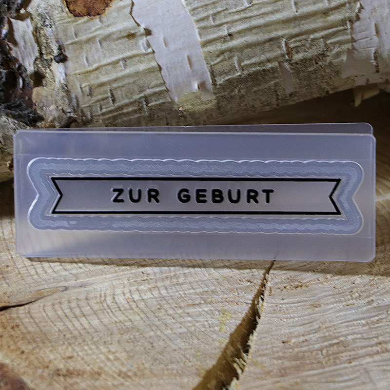 Kombinierte Stanz- und Prägeschablone zur Geburt